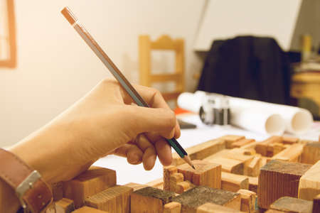 Concept architects, Two asian engineer pointing equipment architects On the desk with a blueprint in the office, Vintage, Sunset light.Selective Focusの写真素材