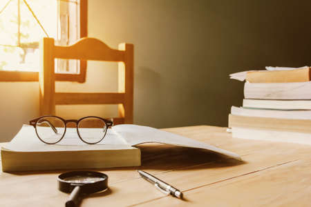 Vintage glasses,on books stack in public library book, Studying examining. learning. People, learning, educationの写真素材