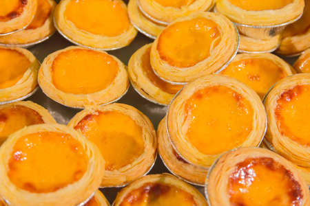 Delicious egg tarts, traditional custard pie, dessert, texture background on street food in thailand
