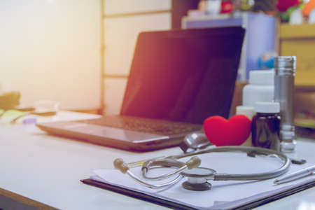 equiment Medical instruments,technology  laptop,stethoscope and glasses on white table.