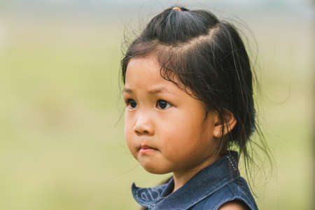 Portrait, standing, or the Asian girls, sad faces.の写真素材