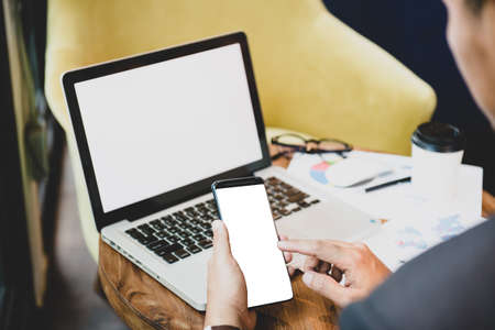 Close up of male hands holding touching mobile phone with blank copy space for your text message in...