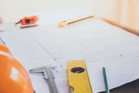 Concept architects, equipment architects On the desk with a blueprint in the office, Vintage, Sunset light.Selective Focusの写真素材