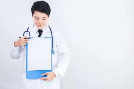 Homosexuality of woman doctor holding Blank paper clipboard,and filling smile on gray background.の写真素材