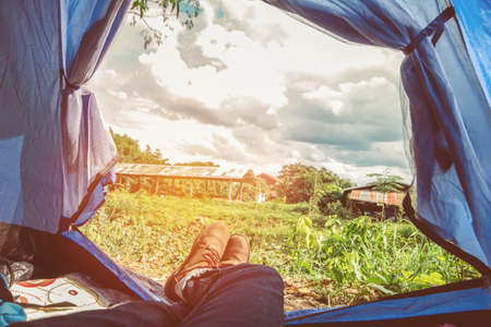 Tent glows lookout on a Camp in the Sky and cloud . Holiday of  relaxing outdoor camping conceptの写真素材