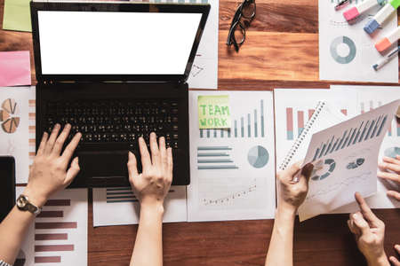 Start up business. people team work meeting point to discuss the graph up and down of economy and...