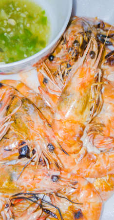 Grilled prawns burned in a white dish.の写真素材