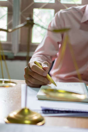 businessman or lawyers sitting office signing contract papers on wood table. Law of advisor Concepts...