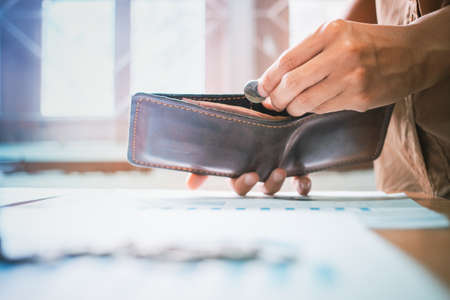 Man taking out money from walletの写真素材