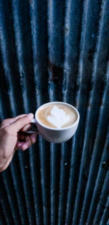 Hot coffee latte art  in cup isolated white background.