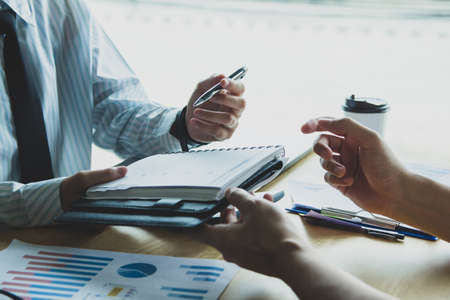 Close-up. Asian business of hand holding pen reviewing and signing,Home buying contract,Selective focusの写真素材