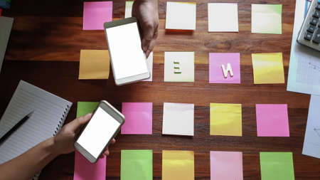 Newsletter concept. Hand of businessman checking message box on mobile phone vintage tone filter
