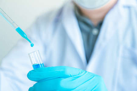 Close up. Medical or science medical in laboratory room research performs tests with liquid,...