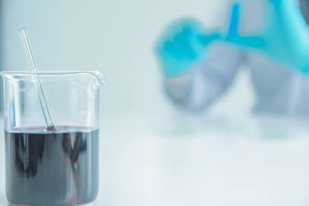 Close-up equipment of Beaker with medical science in laboratory room researcher performs tests  on test tube, Experimental Drug Treatment Chemicalsの写真素材