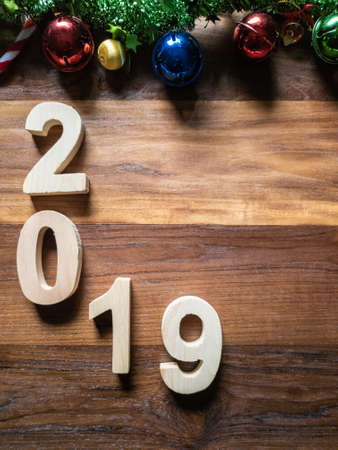 symbol Christmas Tree colorful, Is Number 2019 year on old wooden texture background Empty copy...