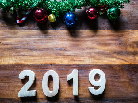 symbol Christmas Tree colorful, Is Number 2019 year on old wooden texture background Empty copy...