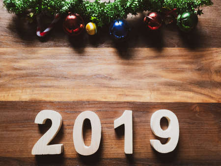 symbol Christmas Tree colorful, Is Number 2019 year on old wooden texture background Empty copy space for inscription design of happy new year 2019 holidayの写真素材