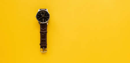 Top view. vintage clock. Minimal Style copyspace for your text on yellow background use for wallpaper and screen.の写真素材