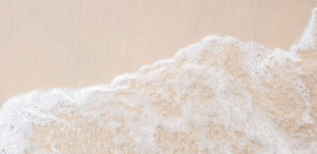 white ocean wave on sandy beach in summer vacation copy space for your text