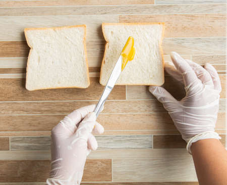 Close up of hand, girls wear gloves clean, Methods and procedures in the sandwich bread. Put...