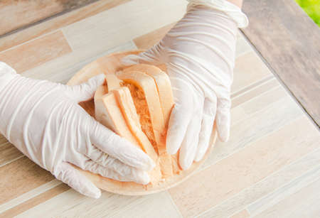 Close up of hand, girls wear gloves clean, Methods and procedures in the sandwich bread. Put...
