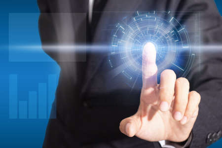Close-up of finger businessman pushing on a touch digital screen interface. Isolated white...