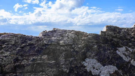 Big heavy of rock stone with blue sky background ,Natural.