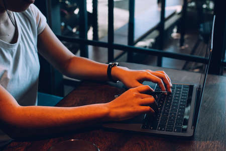 newsletter concept Hand of businessman checking message box on digital laptop Vintage tone filter.の写真素材