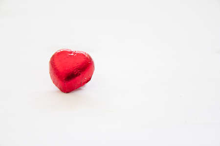 Red heart of Chocolate sweet candy on white wooden background for Valentines Day,Copy space for your...