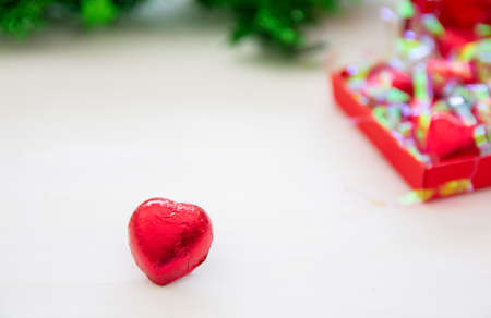 Red heart of Chocolate sweet candy on white wooden background for Valentines Day,Copy space for your...