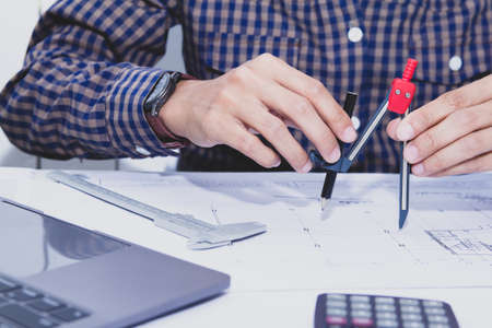 Concept architects,engineer holding Circus pointing equipment architects On the desk with a...