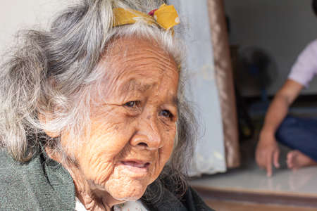 Close-up  senior elderly women. face of sad alone at homeの写真素材
