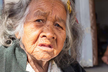 Close-up  senior elderly women. face of sad alone at homeの写真素材