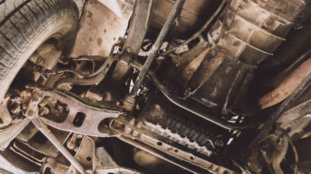 Car lifted in Manual pickup truck at service center for fixing repairs change engine oilの写真素材