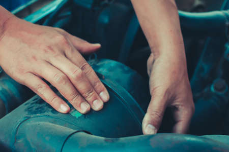 mechanic repair maintenance checking air filter engine, Repair fix a car conceptの写真素材