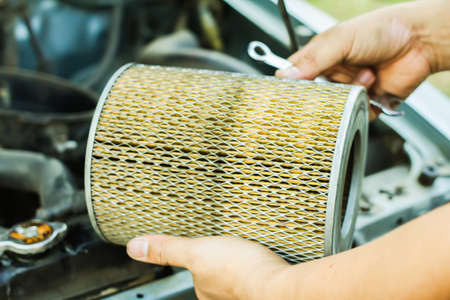 mechanic repair maintenance checking air filter engine, Repair fix a car concept