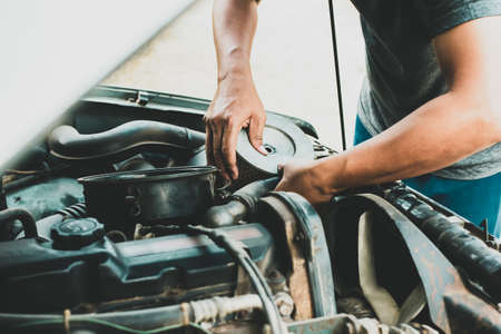 mechanic repair maintenance checking air filter engine, Repair fix a car conceptの写真素材