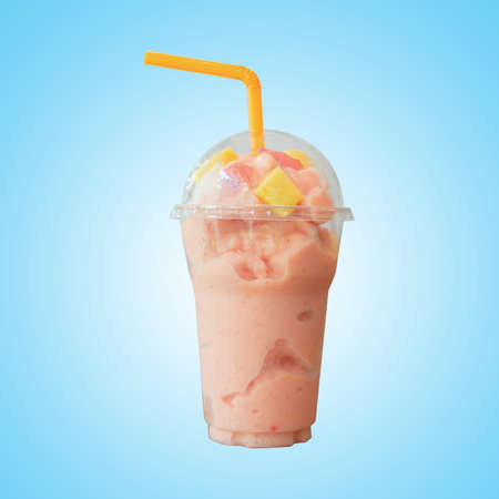 Freshness yogurt milk Strawberry smoothie in plastic glass with tube on blue pastel background