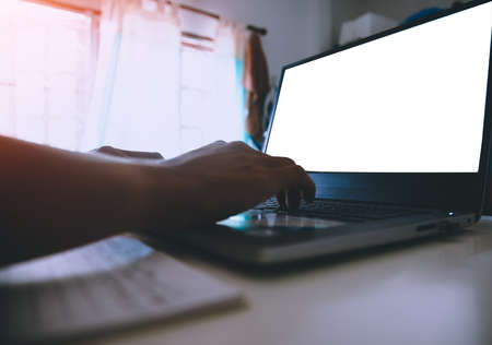 Soft focus, developer programmer typing and checking Website on laptop professional computer Copy space blank  white screen working at the room officeの写真素材