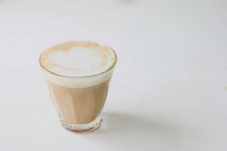 Iced or frappe coffee cup on glass cup on  white table background