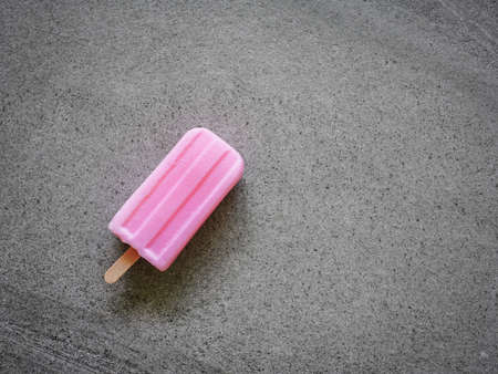 strawberry fruity ice cream stick  on marble background. Copy space for your textの写真素材