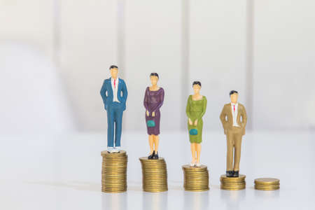 Success people miniature business, businessman and woman teamwork on top of the money-saving work financial concept.の写真素材