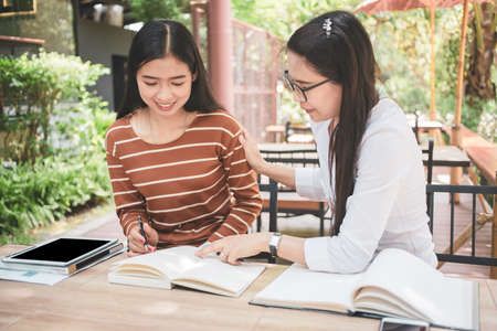 Tutor books with Asian Teacher woman.の写真素材