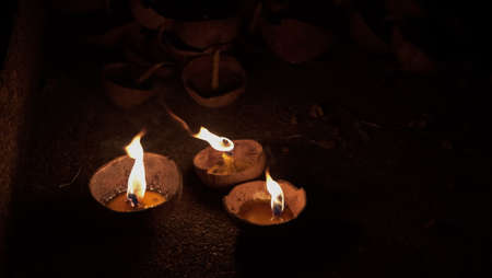 Blur candles in the dark background.
