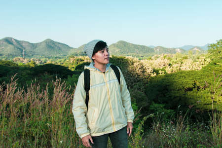 Asian young men 25-30 year selfie standing with mountain blue sky landscape nature hiking outdoor at...
