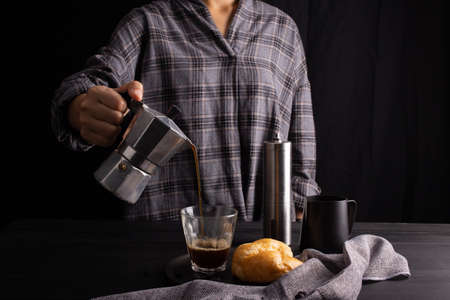 The professional of a barista poured coffee. making milk coffee with equipment, tool brewing on the...