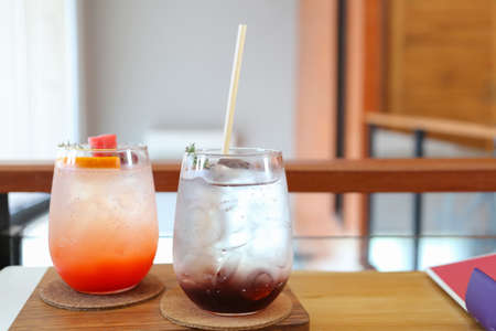 refreshing cold grape soda on wooden table