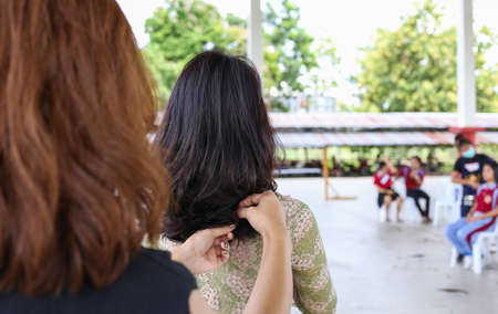 hairstyling, The back. The long hair of a young woman. purple hair highlights
