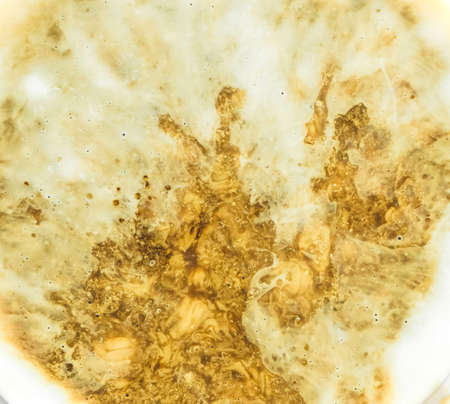 liquid of texture coffee and milk latte art on cup abstract background.