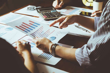 Business Meeting with graph, Growth Analysis, Charts on paper statistics data finance business...
